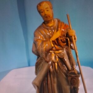 Elegant Ceramic Pilgrim Figurine in Brown and Gold